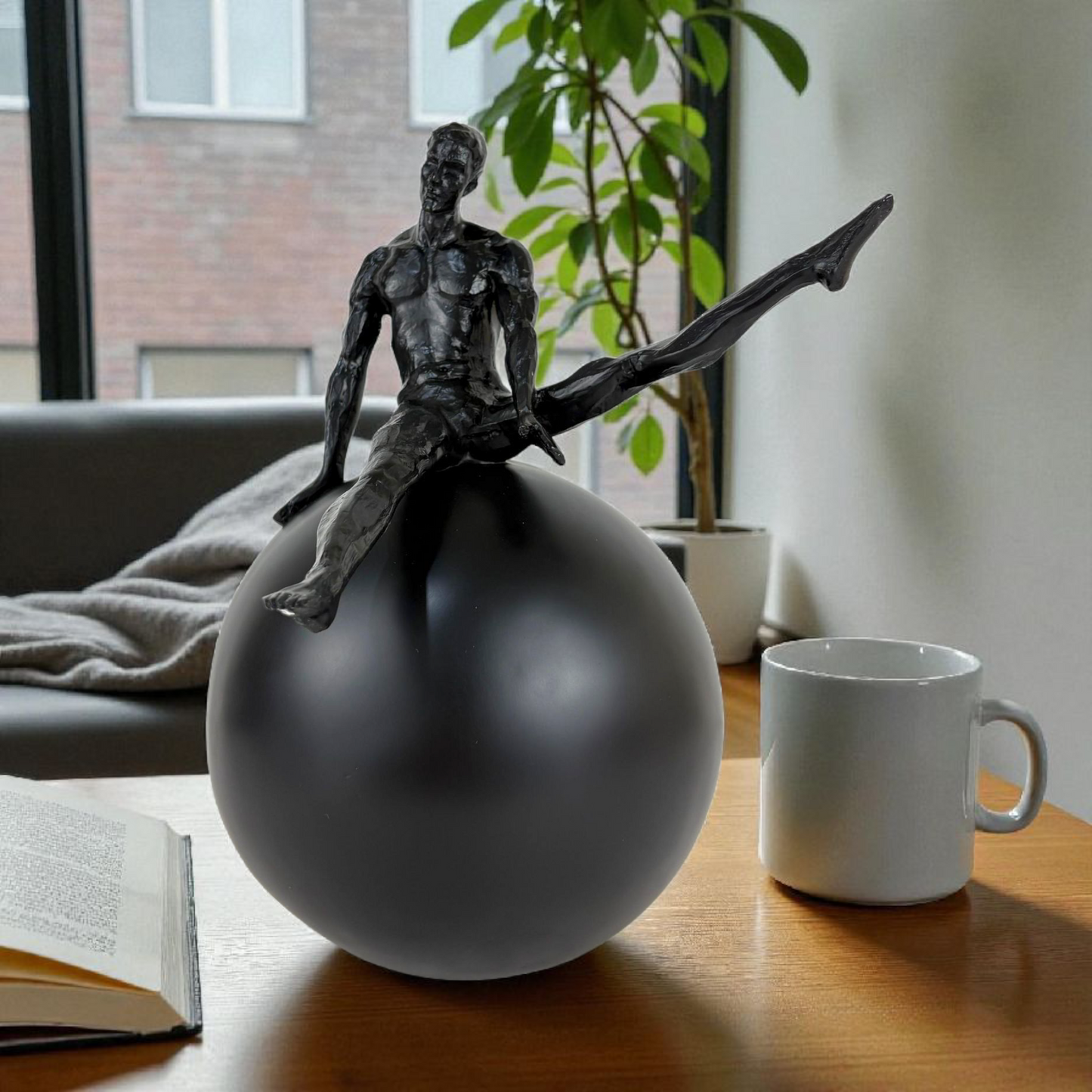 Modern Abstract Man on Sphere Sculpture – Black Minimalist Decor